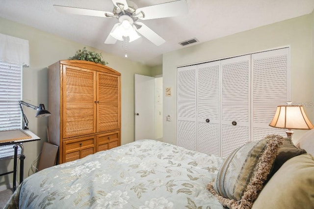 bedroom featuring ceiling fan and a closet