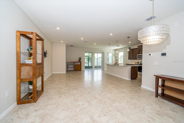 living room with french doors and light tile patterned floors