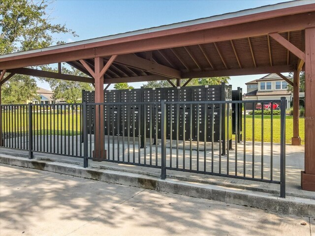 view of gate featuring a lawn