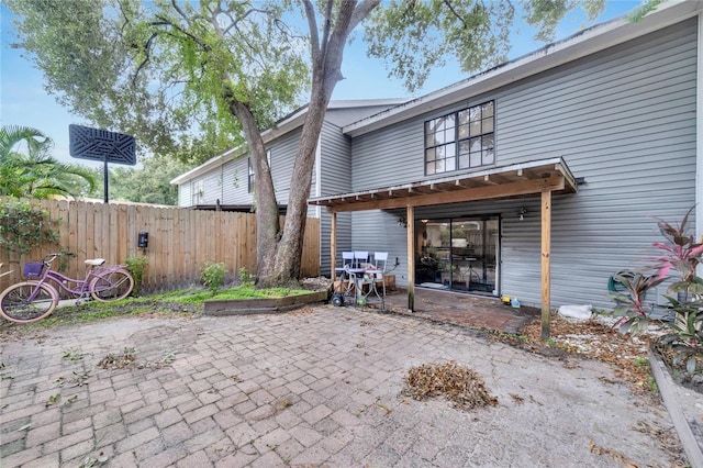 rear view of property featuring a patio