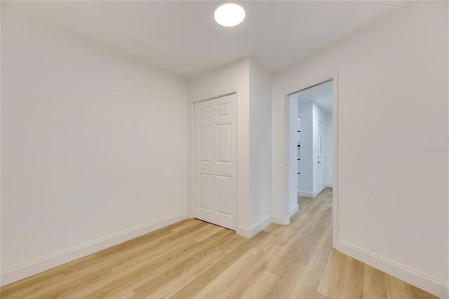 spare room featuring light hardwood / wood-style floors