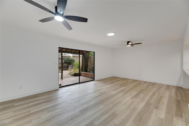 unfurnished room featuring ceiling fan and light wood-type flooring