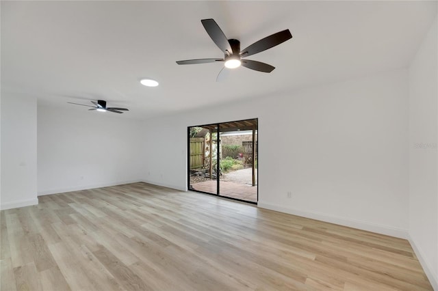 unfurnished room featuring light wood-style floors, ceiling fan, and baseboards