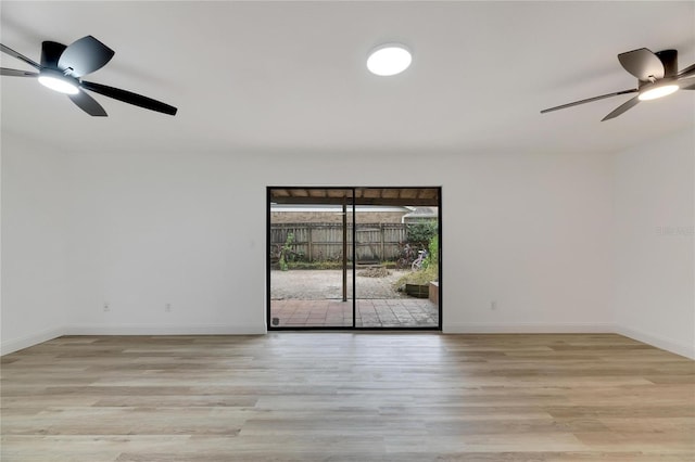 unfurnished room with light wood-style floors, ceiling fan, and baseboards