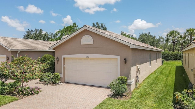 exterior space with a garage and a front yard