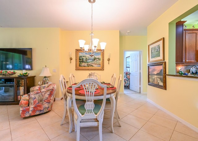 dining area with an inviting chandelier and light tile patterned floors