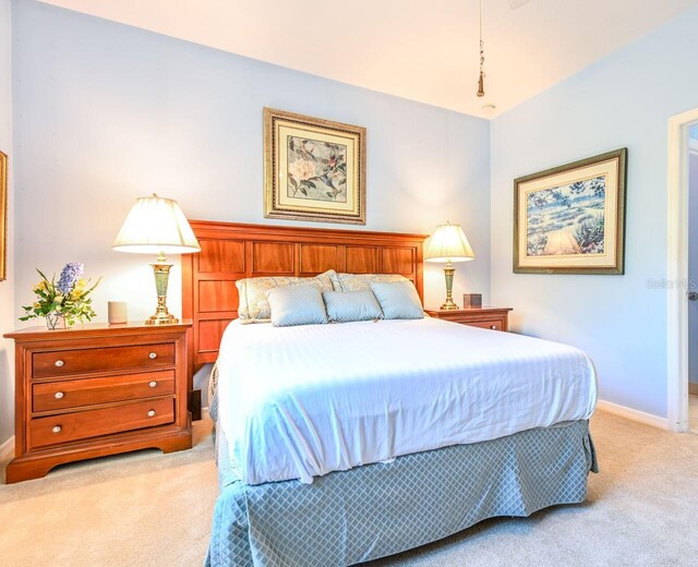 bedroom with light colored carpet