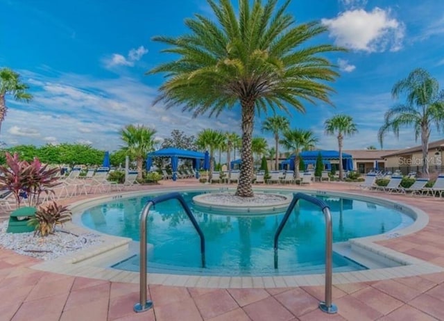 view of swimming pool featuring a patio area