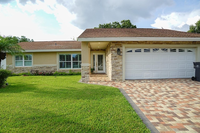 view of front of home with a garage and a front yard