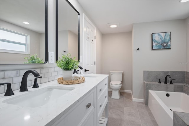 bathroom featuring vanity, a bath, decorative backsplash, tile patterned floors, and toilet