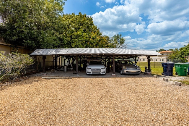 view of parking with a detached carport