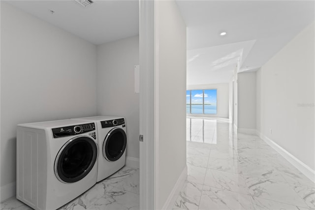 laundry room featuring independent washer and dryer