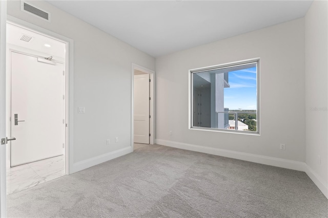 view of carpeted spare room