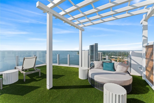 balcony with a pergola and a water view