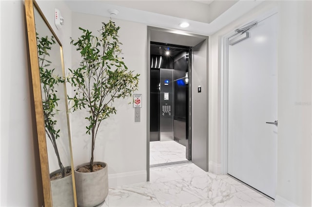 2910 W Barcelona St Unit 903, Tampa, FL 33629 - corridor featuring marble finish floor, baseboards, and recessed lighting