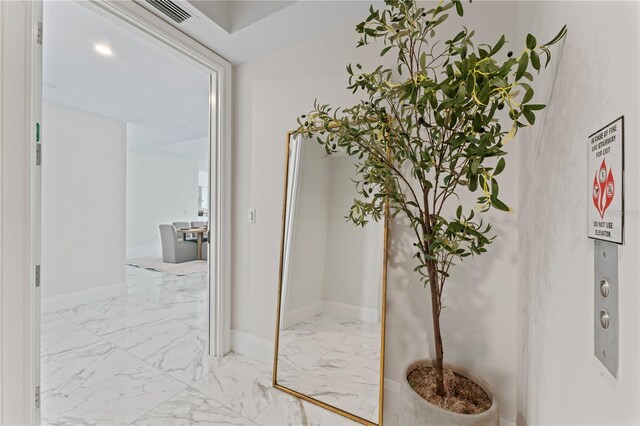 2910 W Barcelona St Unit 903, Tampa, FL 33629 - corridor with marble finish floor, baseboards, and visible vents