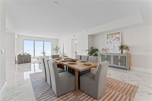 2910 W Barcelona St Unit 903, Tampa, FL 33629 - dining room featuring marble finish floor and baseboards