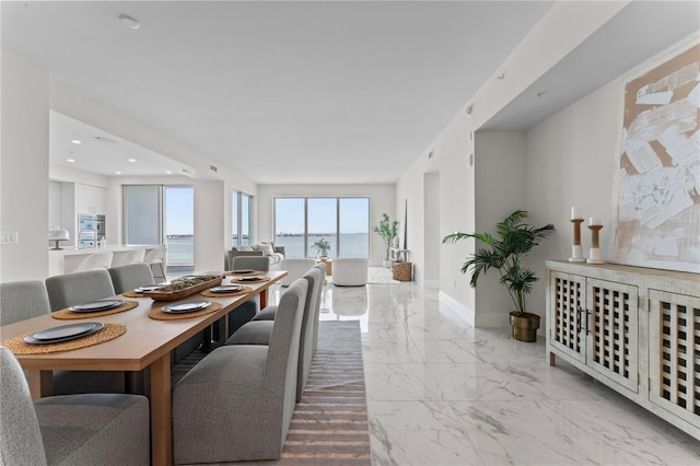 2910 W Barcelona St Unit 903, Tampa, FL 33629 - dining room featuring baseboards, marble finish floor, and recessed lighting