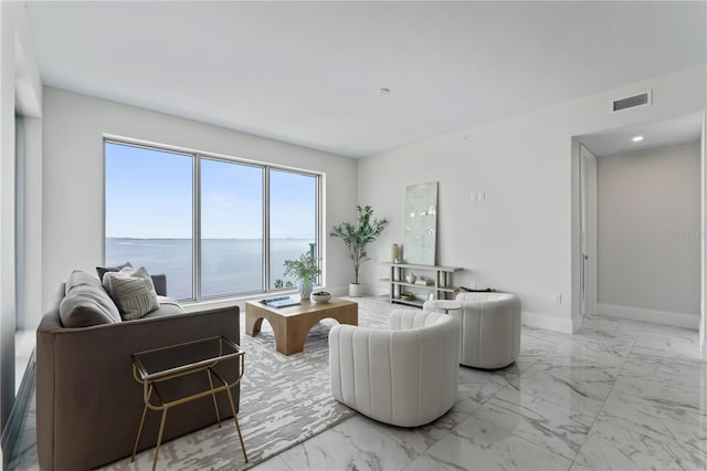 2910 W Barcelona St Unit 903, Tampa, FL 33629 - living area with visible vents, marble finish floor, baseboards, and a water view