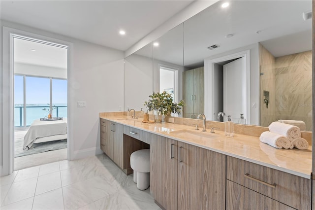 2910 W Barcelona St Unit 903, Tampa, FL 33629 - full bathroom with visible vents, a sink, a water view, and a stall shower