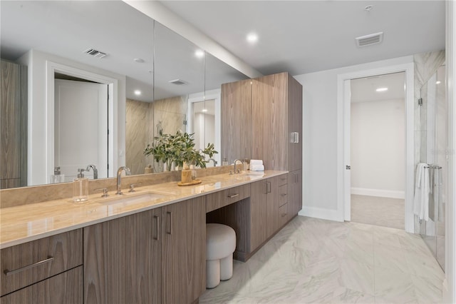 2910 W Barcelona St Unit 903, Tampa, FL 33629 - bathroom featuring baseboards, a sink, marble finish floor, and double vanity