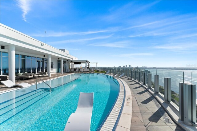 2910 W Barcelona St Unit 903, Tampa, FL 33629 - pool featuring a diving board, an outdoor living space, and a patio