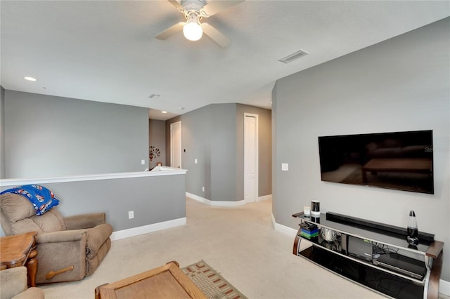 living room with light carpet and ceiling fan