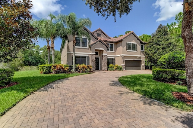 view of front facade featuring a front lawn and a garage