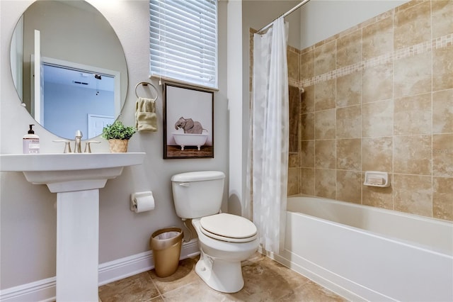 bathroom featuring toilet and shower / bath combo with shower curtain