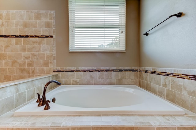 bathroom featuring tiled bath