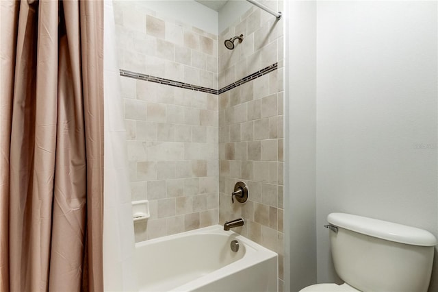 bathroom featuring toilet and shower / bath combo with shower curtain