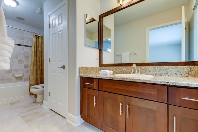 full bathroom featuring tile patterned flooring, vanity, toilet, and shower / bath combo with shower curtain