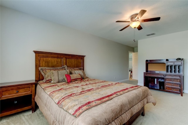 bedroom featuring light carpet and ceiling fan