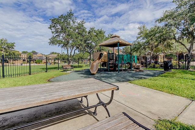 view of playground featuring a lawn