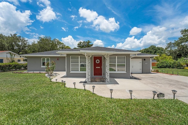 single story home with a front yard and a garage