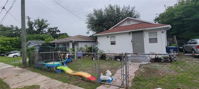 bungalow featuring a playground