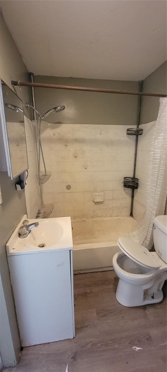 bathroom featuring vanity, toilet, and hardwood / wood-style floors