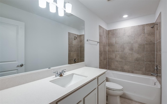 full bathroom with tiled shower / bath combo, toilet, and vanity