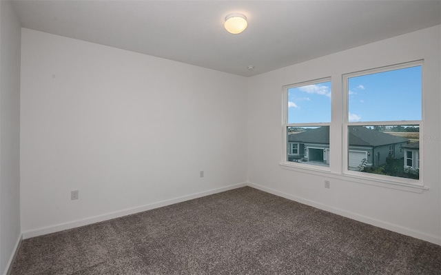 unfurnished room with carpet floors