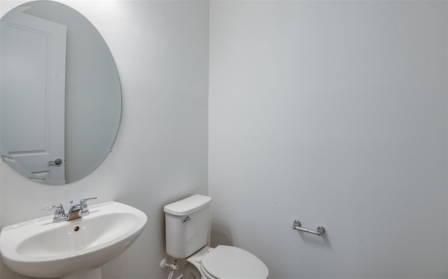 bathroom with sink and toilet