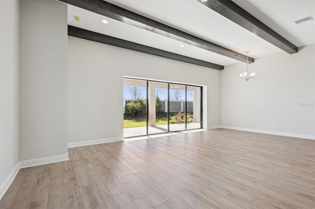 empty room featuring light hardwood / wood-style flooring, beamed ceiling, and an inviting chandelier