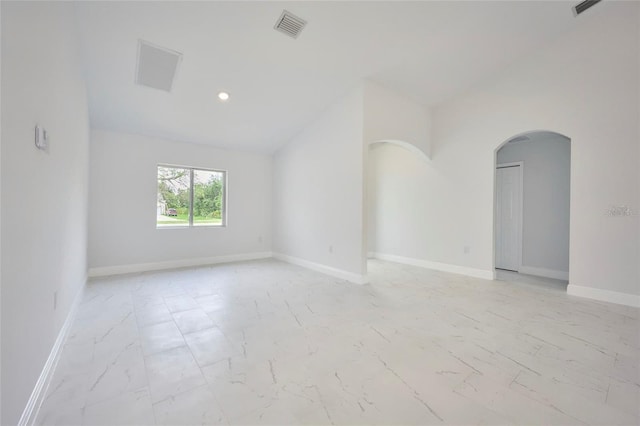 empty room with vaulted ceiling