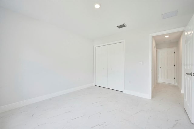 unfurnished bedroom featuring a closet