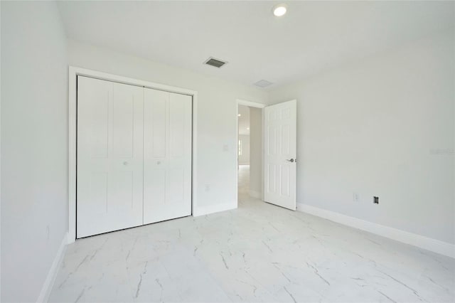 unfurnished bedroom featuring a closet