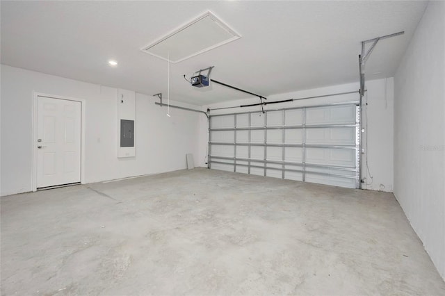 garage featuring a garage door opener and electric panel