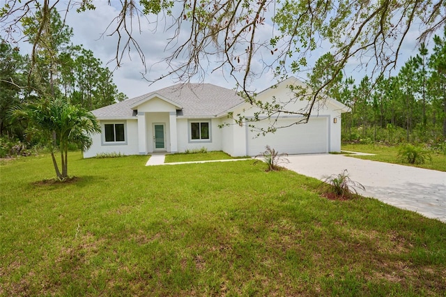 view of front of home with a garage and a front lawn