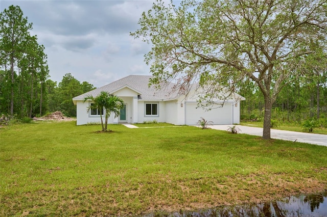 view of front of home featuring a garage and a front yard