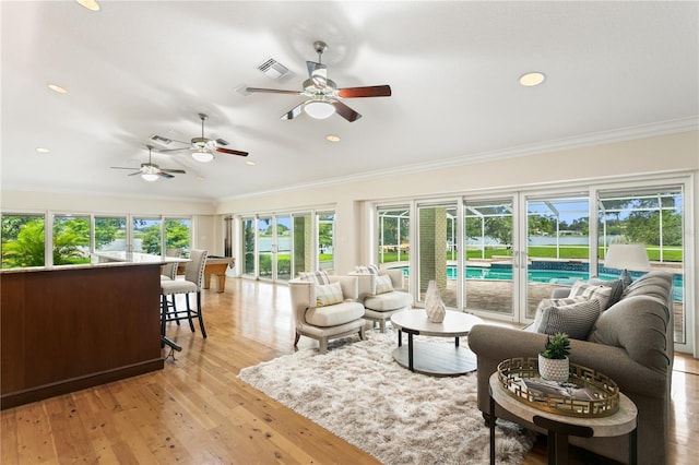 sunroom with ceiling fan and a wealth of natural light