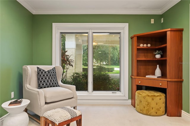 sitting room with carpet flooring and crown molding