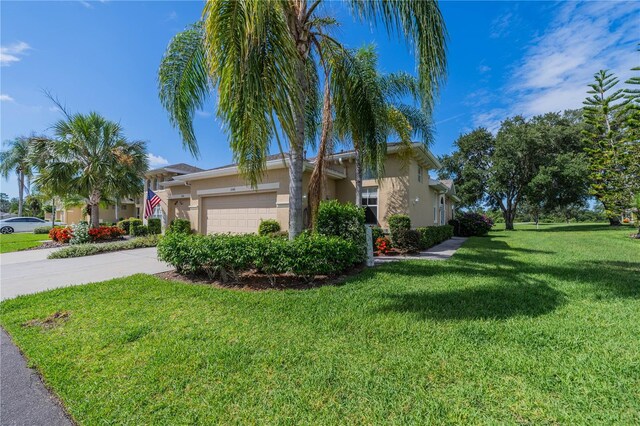 view of front of house featuring a garage and a front yard